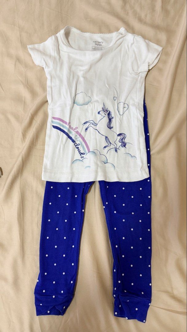 Carter's Unicorn Rainbow Pajama Set 3T (Category: Babies & Kids Fashion) located in Cainta. Submitted by carlaloo07 (Listing ID 1440984911, Image 1). Description: - Brand: Carter's - Size: 3T - Set includes: White t-shirt with unicorn, rainbow, and clouds graphic - Pants: Blue with white polka dots - Material: Comfortable for sleep.