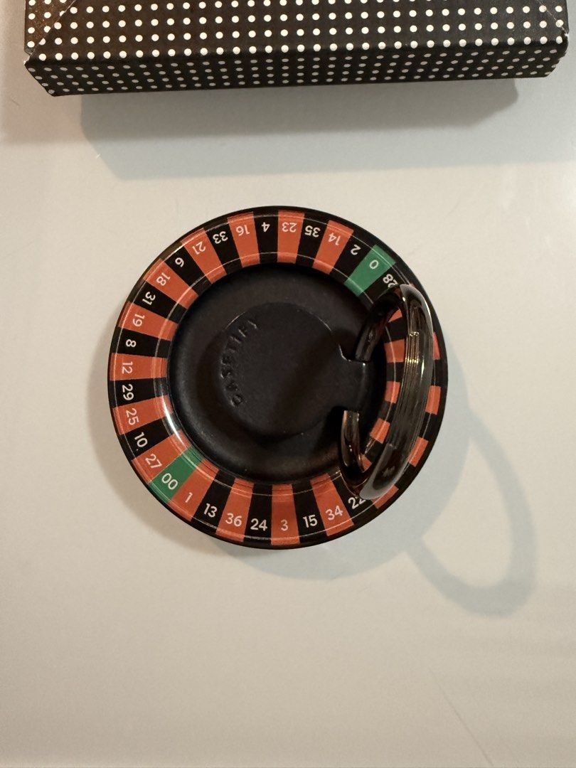 Casetify Casino Roulette Wheel with Black Case (Category: Mounts & Holders) located in Quezon City. Submitted by tulip03 (Listing ID 1441116289, Image 1). Description: - Mini roulette wheel for fun - Features black and red numbers, including 0 and 00 slots - Includes a protective black circular case - Ideal for game nights or as a novelty item - Smooth spinning action.