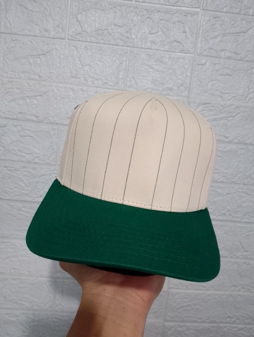 C.C Pinstripe Plain Two tone Green/Beige A-frame snapback Cap (Category: Caps & Hats) located in Caloocan City. Submitted by zklclo (Listing ID 1440967212, Image 1). Description: C.C Pinstripe Plain Two tone Green/Beige A-frame snapback Cap Issue: missing top button minimal stain 𝐅𝐈𝐑𝐒𝐓 𝐓𝐎 𝐏𝐀𝐘 𝐁𝐀𝐒𝐈𝐒 👉Courier: J&T and lalamove 👉No free shipping 👉Location: North Caloocan 👉Mode of Payment: Gcash.