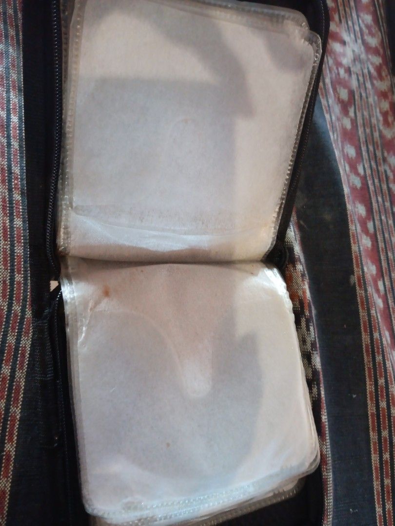 CD Case (Category: CDs & DVDs) located in Sungai Buloh. Submitted by pfoo3 (Listing ID 1441000744, Image 3). Description: - Uncle Dan's Products Plaid CD Case - Zipper closure for secure storage - Ample space for multiple CDs - Ideal for organizing your music collection - Protects discs during travel - Compact and portable design.