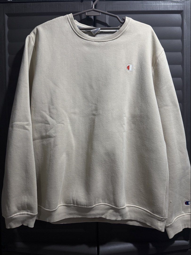 Champion (Sweater) (Category: Coats, Jackets and Outerwear) located in Cainta. Submitted by declutterbylou_ (Listing ID 1441064068, Image 1). Description: Champion Sweater Color: Off White Size: XXL L: 27 in W: 23 in 8/10 - Used, small hole PAYO only, No Refund MOD: (buyer’s shoulder del. fee) J&T/Lalamove/Grab .