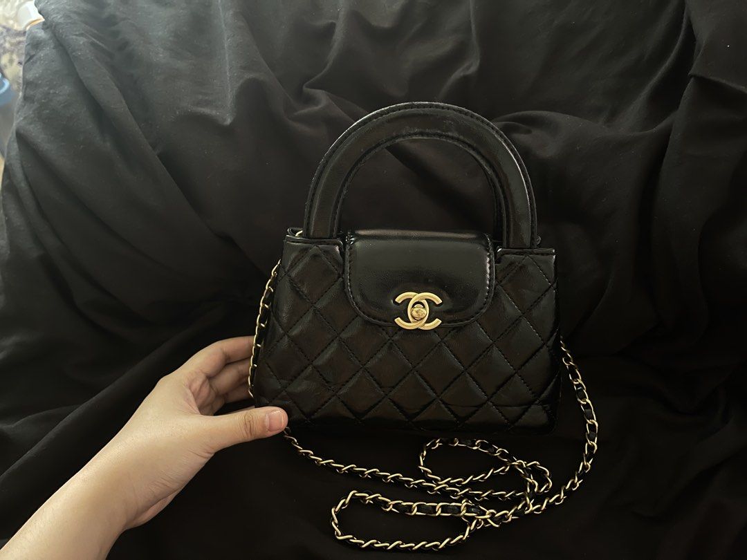 Chanel Kelly Sling Bag (Category: Luxury Bags & Wallets) located in San Juan City. Submitted by cocodeclutter771 (Listing ID 1441022341, Image 3). Description: - Black patent leather handbag - bought it for 15k now selling for 2600 - Quilted design with gold hardware - Top handle and detachable gold chain strap - Small size, ideal for essentials - Minor wear on handle - the flaws shown in photos.