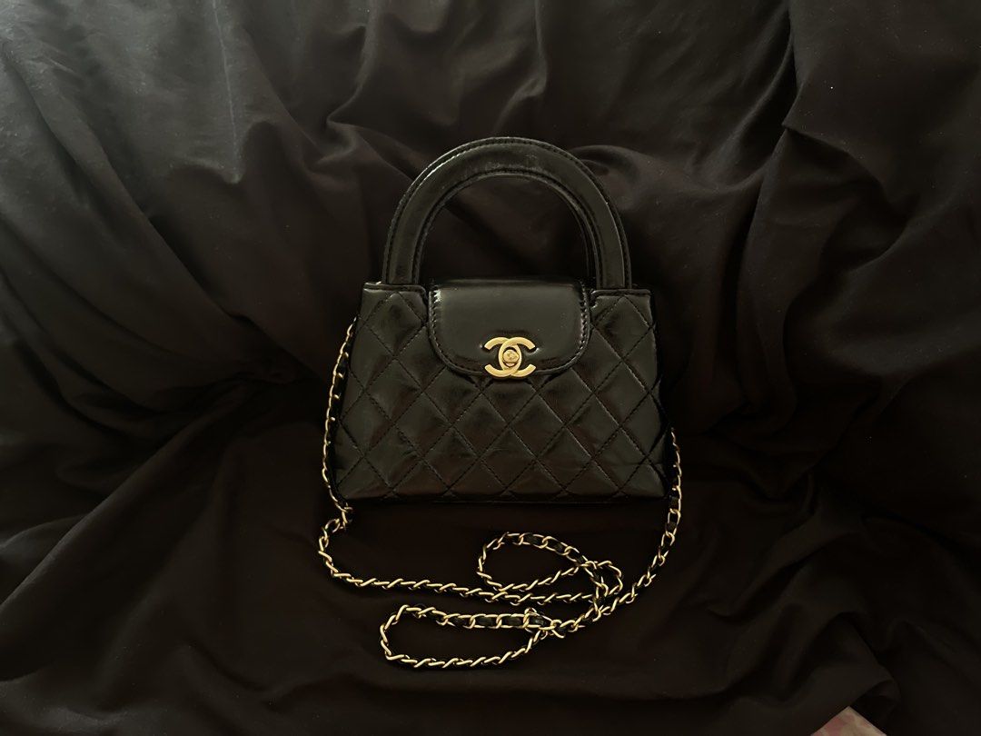 Chanel Kelly Sling Bag (Category: Luxury Bags & Wallets) located in San Juan City. Submitted by cocodeclutter771 (Listing ID 1441022341, Image 2). Description: - Black patent leather handbag - bought it for 15k now selling for 2600 - Quilted design with gold hardware - Top handle and detachable gold chain strap - Small size, ideal for essentials - Minor wear on handle - the flaws shown in photos.