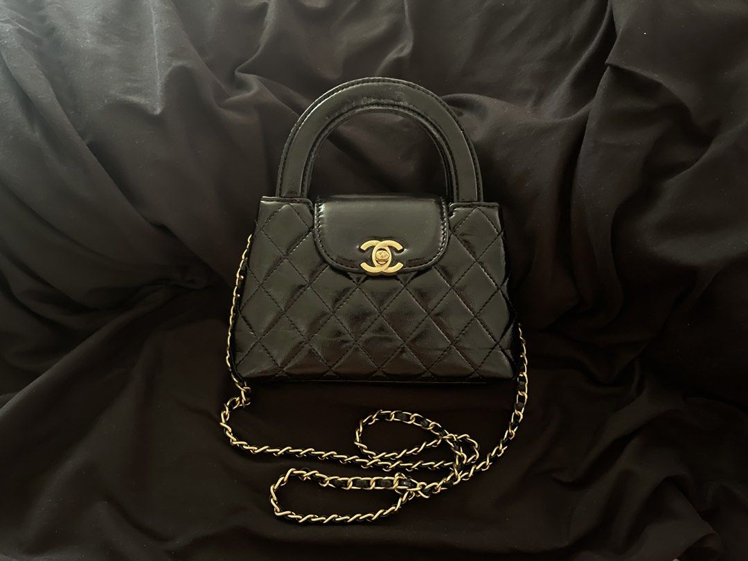 Chanel Kelly Sling Bag (Category: Luxury Bags & Wallets) located in San Juan City. Submitted by cocodeclutter771 (Listing ID 1441022341, Image 1). Description: - Black patent leather handbag - bought it for 15k now selling for 2600 - Quilted design with gold hardware - Top handle and detachable gold chain strap - Small size, ideal for essentials - Minor wear on handle - the flaws shown in photos.