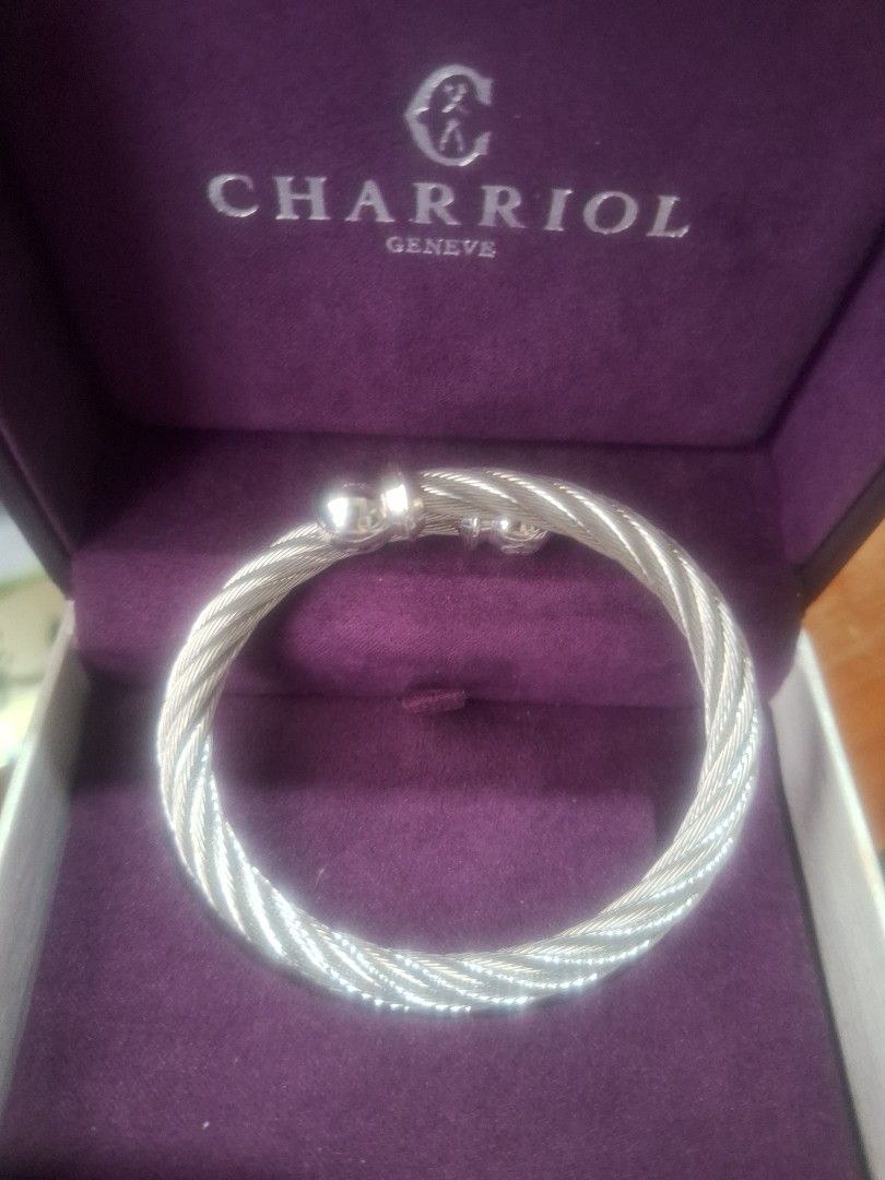 Charriol Geneve Silver Twisted Cable Bangle Bracelet (Category: Bracelets) located in Manila. Submitted by soft_autumn (Listing ID 1440974824, Image 1). Description: 9in, Large - Authentic Charriol Geneve bangle - Silver twisted cable design - Signature Charriol clasp - Comes with original Charriol box - Classic piece for any jewelry collection - Suitable for everyday wear or special occasions Location: Gensan.