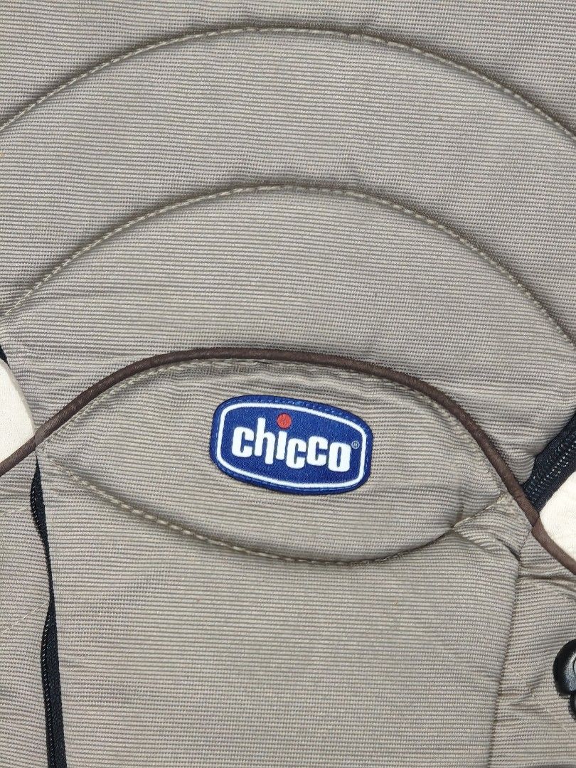 Chicco Baby Carrier (Category: Carriers & Slings) located in Zamboanga. Submitted by gothicstyle_etc (Listing ID 1441078228, Image 2). Description: - Chicco baby carrier in neutral beige - Adjustable straps for a comfortable fit - Easy to buckle and unbuckle - Padded head support for baby's comfort - Allows for hands-free carrying - Minor signs of wear, but fully functional.