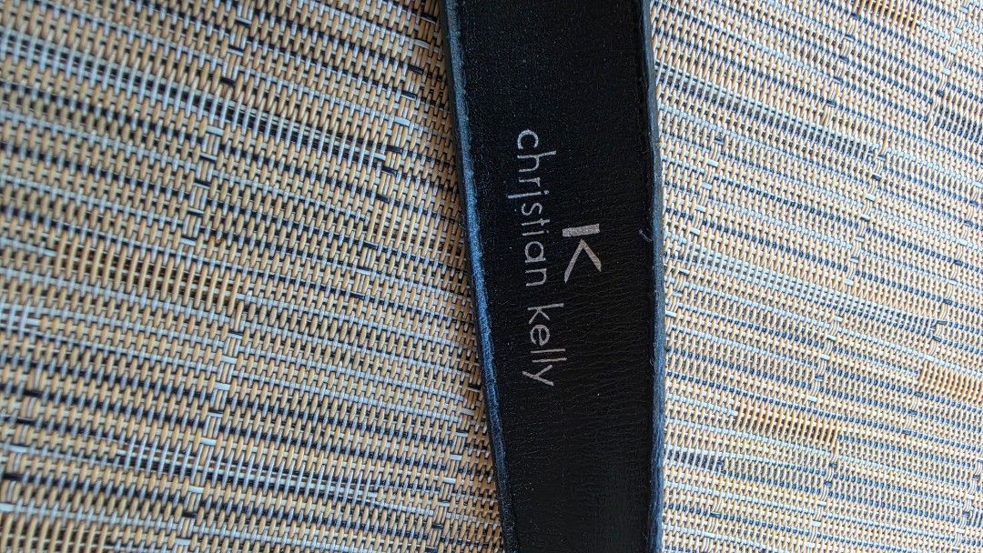 Christian Kelly Black Leather Belt (Category: Belts) located in Naga. Submitted by solamia (Listing ID 1440964530, Image 2). Description: - Genuine black leather belt from Christian Kelly - Classic silver buckle - Christian Kelly brand name embossed on leather - Perfect for everyday wear - Please check photos for detailed condition.