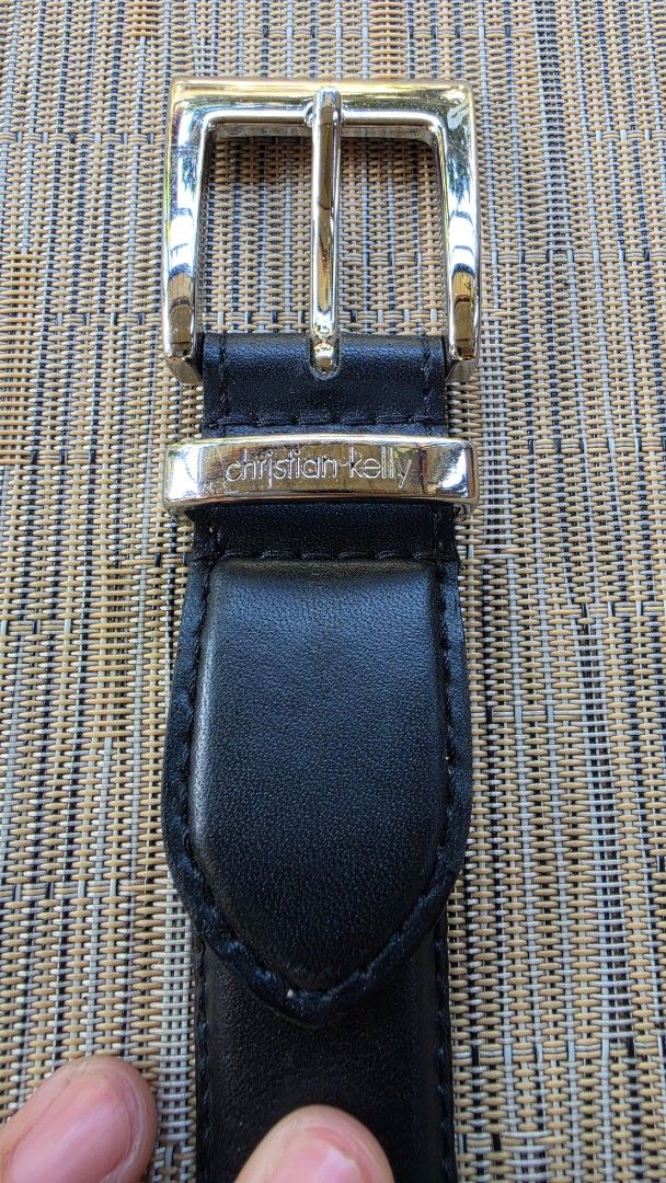Christian Kelly Black Leather Belt (Category: Belts) located in Naga. Submitted by solamia (Listing ID 1440964530, Image 1). Description: - Genuine black leather belt from Christian Kelly - Classic silver buckle - Christian Kelly brand name embossed on leather - Perfect for everyday wear - Please check photos for detailed condition.