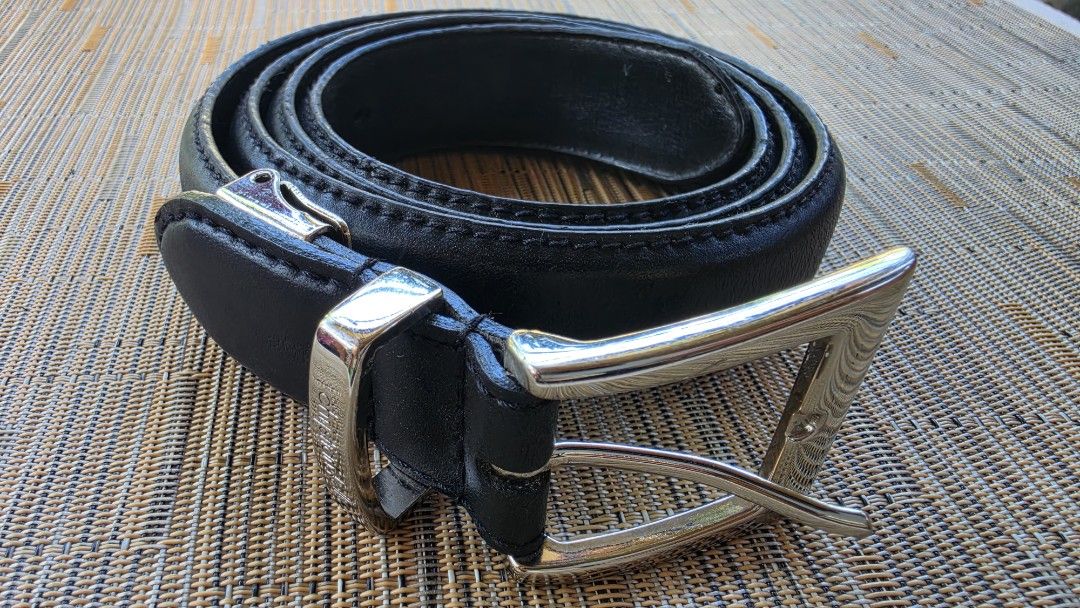 Christian Kelly Black Leather Belt (Category: Belts) located in Naga. Submitted by solamia (Listing ID 1440964530, Image 3). Description: - Genuine black leather belt from Christian Kelly - Classic silver buckle - Christian Kelly brand name embossed on leather - Perfect for everyday wear - Please check photos for detailed condition.