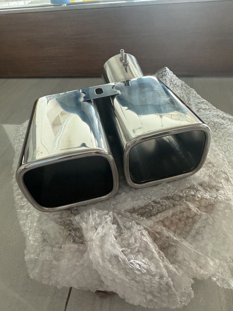 Chrome Dual Outlet Exhaust Muffler Tip (Category: Mufflers and Exhaust Parts and Accessories) located in Makati City. Submitted by gonz4669 (Listing ID 1440962119, Image 1). Description: - Universal dual exhaust tip for a sporty look - Made from durable, polished stainless steel - Secure clamp-on installation with screws - Fits most vehicle models .