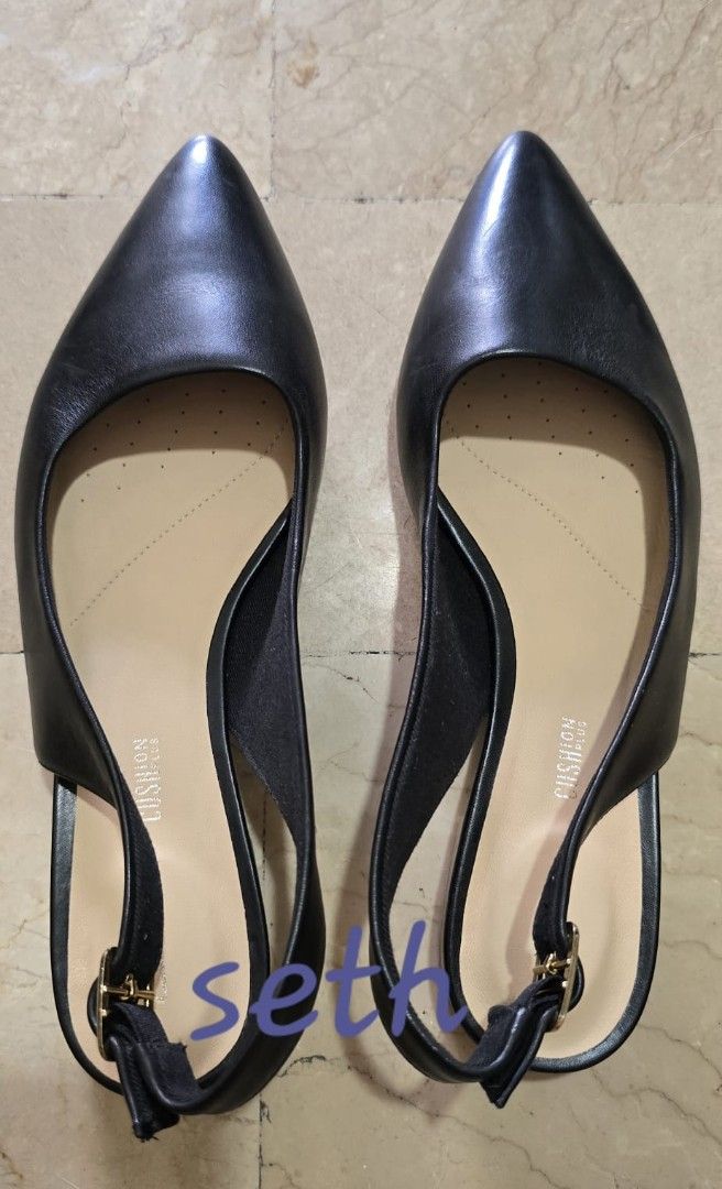 Clarks Black Leather Slingback Pointed Toe Heels (Category: Flats & Sandals) located in Quezon City. Submitted by sethplate (Listing ID 1440975500, Image 1). Description: - Brand: Clarks - Style: Slingback Heels - Material: Black Leather - Toe: Pointed - Closure: Adjustable strap with buckle - Features: Comfortable cushioned insole - Versatile: Great for work or casual wear - Condition: Please check photos for details.