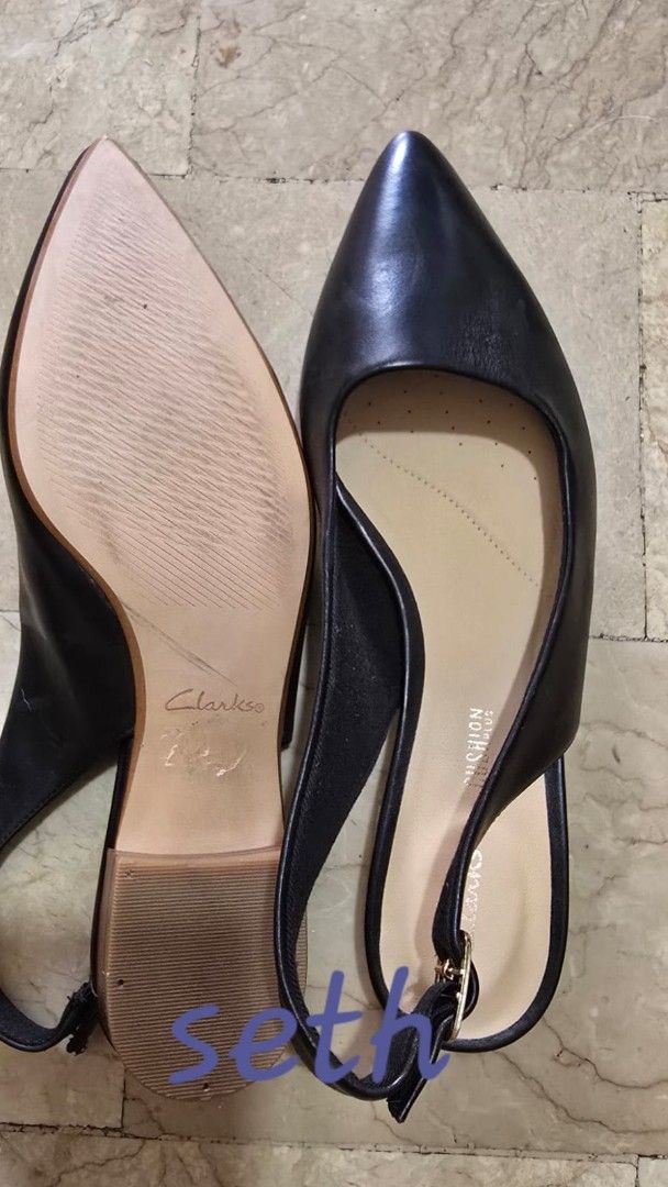 Clarks Black Leather Slingback Pointed Toe Heels (Category: Flats & Sandals) located in Quezon City. Submitted by sethplate (Listing ID 1440975500, Image 2). Description: - Brand: Clarks - Style: Slingback Heels - Material: Black Leather - Toe: Pointed - Closure: Adjustable strap with buckle - Features: Comfortable cushioned insole - Versatile: Great for work or casual wear - Condition: Please check photos for details.