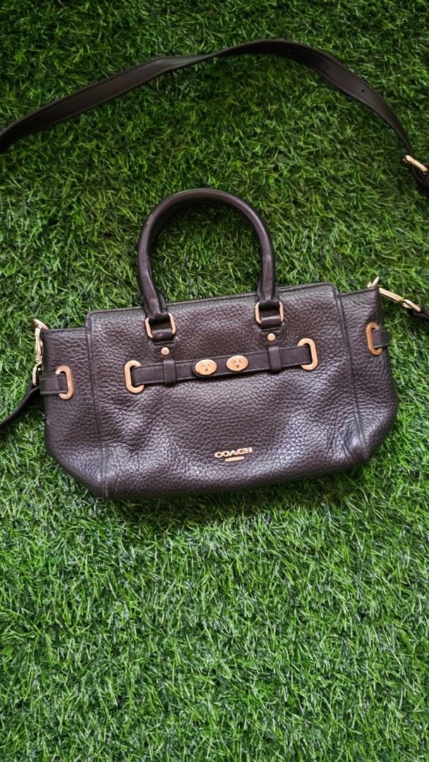 Coach Black Pebbled Leather Satchel Bag (Category: Luxury Bags & Wallets) located in Kibawe. Submitted by Thrift_ni_Babac (Listing ID 1441050639, Image 2). Description: - Genuine black pebbled leather Coach Blake Carryall - Versatile: Top handles and detachable crossbody strap - Elegant gold hardware details - Interior organization: 1 zippered pocket, 1 slip pocket - Ideal for everyday use - Note: Minor wear on interior Coach logo tag.