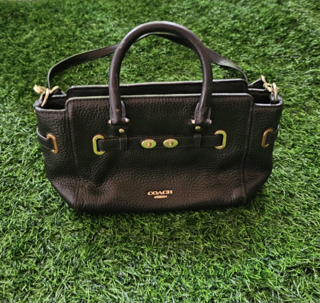 Coach Black Pebbled Leather Satchel Bag (Category: Luxury Bags & Wallets) located in Kibawe. Submitted by Thrift_ni_Babac (Listing ID 1441050639, Image 3). Description: - Genuine black pebbled leather Coach Blake Carryall - Versatile: Top handles and detachable crossbody strap - Elegant gold hardware details - Interior organization: 1 zippered pocket, 1 slip pocket - Ideal for everyday use - Note: Minor wear on interior Coach logo tag.