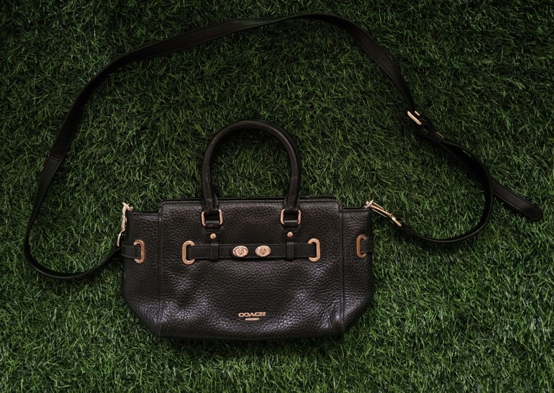 Coach Black Pebbled Leather Satchel Bag (Category: Luxury Bags & Wallets) located in Kibawe. Submitted by Thrift_ni_Babac (Listing ID 1441050639, Image 1). Description: - Genuine black pebbled leather Coach Blake Carryall - Versatile: Top handles and detachable crossbody strap - Elegant gold hardware details - Interior organization: 1 zippered pocket, 1 slip pocket - Ideal for everyday use - Note: Minor wear on interior Coach logo tag.
