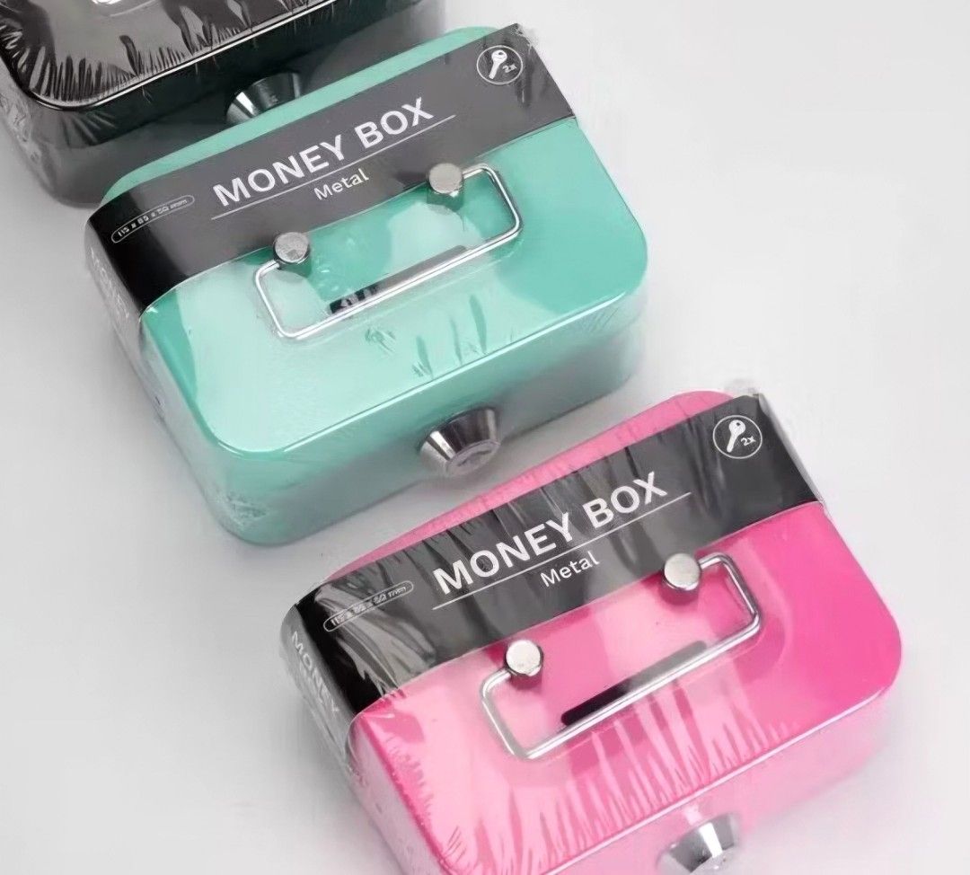 Coin Money Box with Lock and Keys (Category: Storage Boxes & Baskets) located in Quezon City. Submitted by ana-chan (Listing ID 1441091589, Image 1). Description: - Sturdy metal construction for durability. - Secure lock with included keys to protect your savings. - Available in pink/green of colors to suit your preference. - Ideal for both kids and adults for saving money..