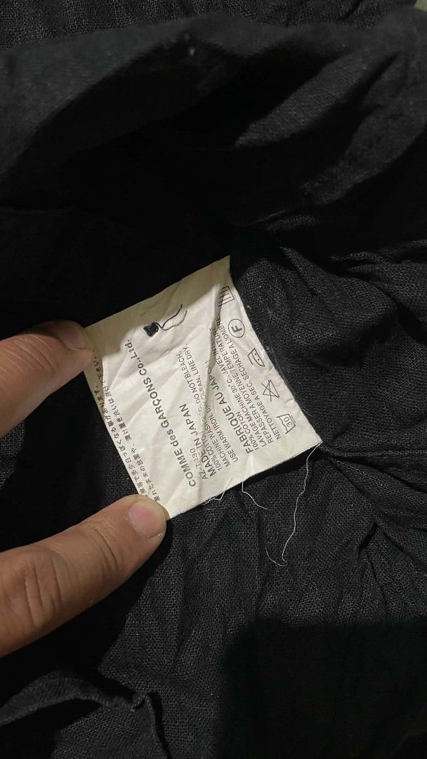 Comme des Garçons PLAY Black Button-Up Shirt (Category: Shirts) located in Barotac Nuevo. Submitted by gray101 (Listing ID 1441106043, Image 3). Description: - Brand: Comme des Garçons PLAY - Color: Black - Size: L - Origin: Made in Japan - Style: Classic collared button-up shirt - Versatile: Suitable for casual and semi-formal occasions.