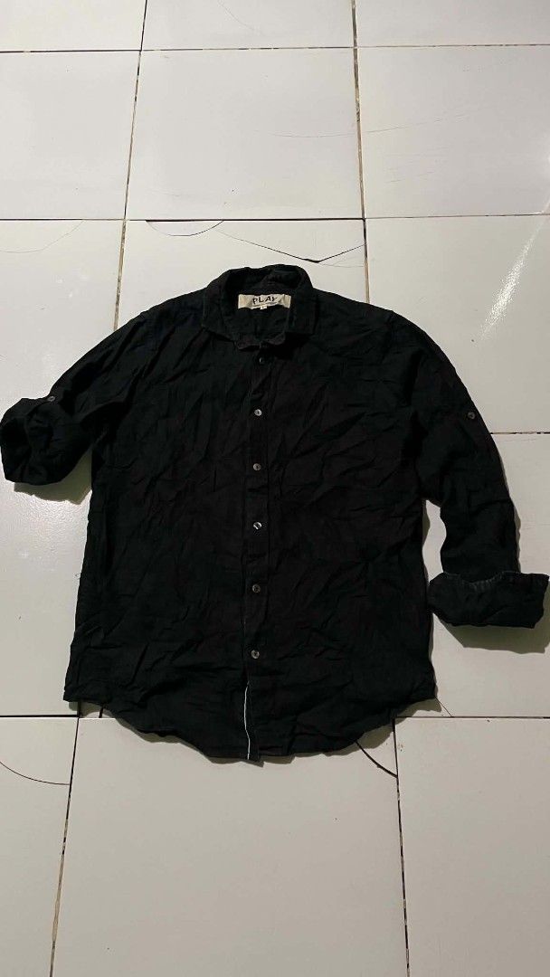 Comme des Garçons PLAY Black Button-Up Shirt (Category: Shirts) located in Barotac Nuevo. Submitted by gray101 (Listing ID 1441106043, Image 2). Description: - Brand: Comme des Garçons PLAY - Color: Black - Size: L - Origin: Made in Japan - Style: Classic collared button-up shirt - Versatile: Suitable for casual and semi-formal occasions.