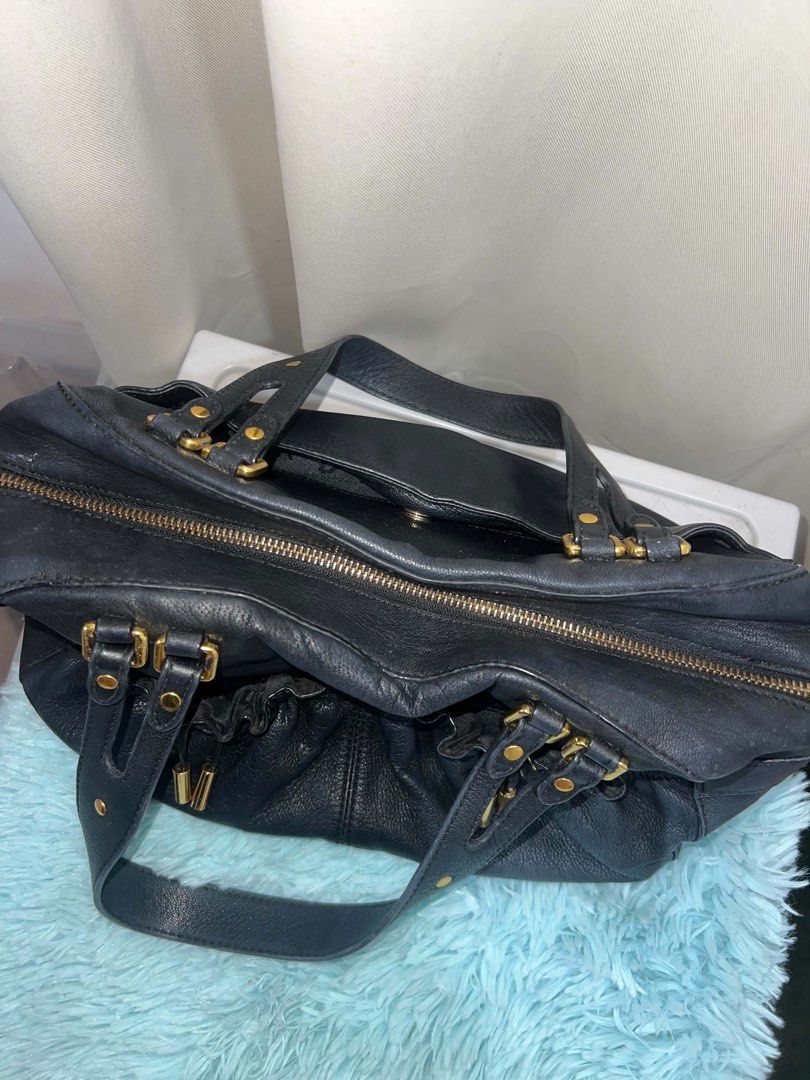 DKNY leather satchel (Authentic) (Category: Luxury Bags & Wallets) located in Manila. Submitted by pp_doesit (Listing ID 1441072295, Image 2). Description: Authentic from US Nagbakbak lang sa loob due to age Outside is clean and intact Cavite Area.