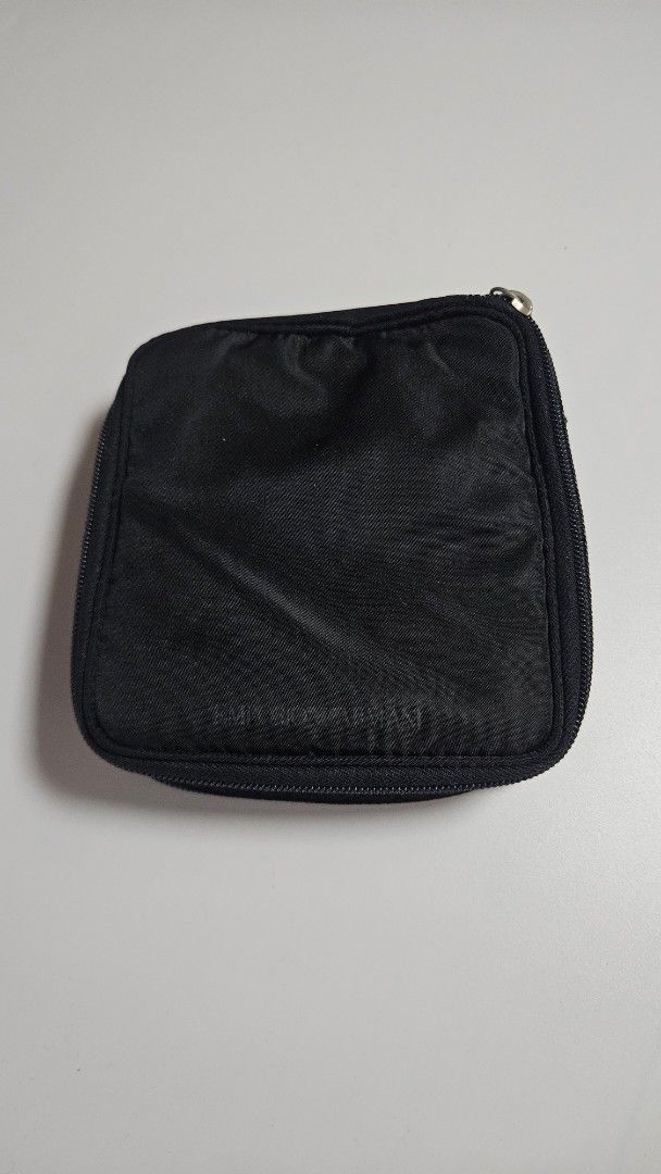 Emporio Armani Black Nylon Pouch (Category: Luxury Bags & Wallets) located in Alfonso. Submitted by jbcamet (Listing ID 1441036811, Image 1). Description: - Authentic Emporio Armani pouch - Made of durable nylon material - Secure zippered closure - Interior features multiple card slots for organization - Compact and easy to carry - Signature Emporio Armani logo pattern inside.