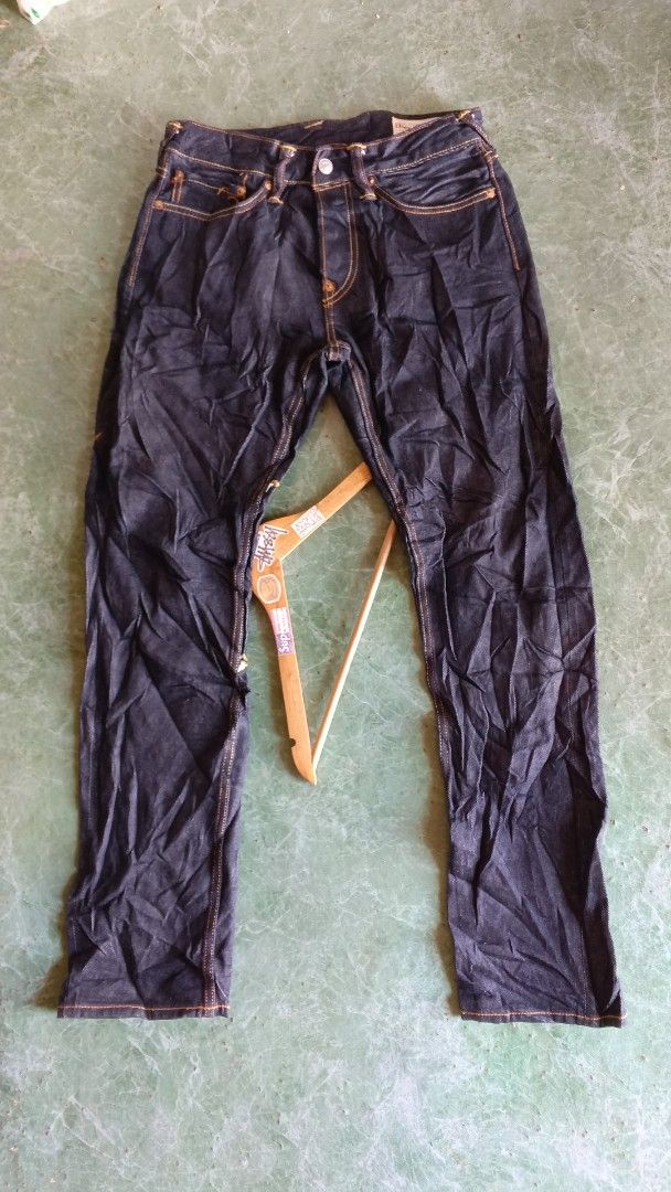 EVISU Jeans Dragon Embroidery Size 29 (Category: Jeans) located in Cateel. Submitted by tsedrickra31083 (Listing ID 1441095391, Image 1). Description: - Dark wash EVISU jeans - Size 30 waist - Large dragon and wave embroidery on back - Orange contrast stitching throughout - Button fly closure - Ideal for streetwear enthusiasts.