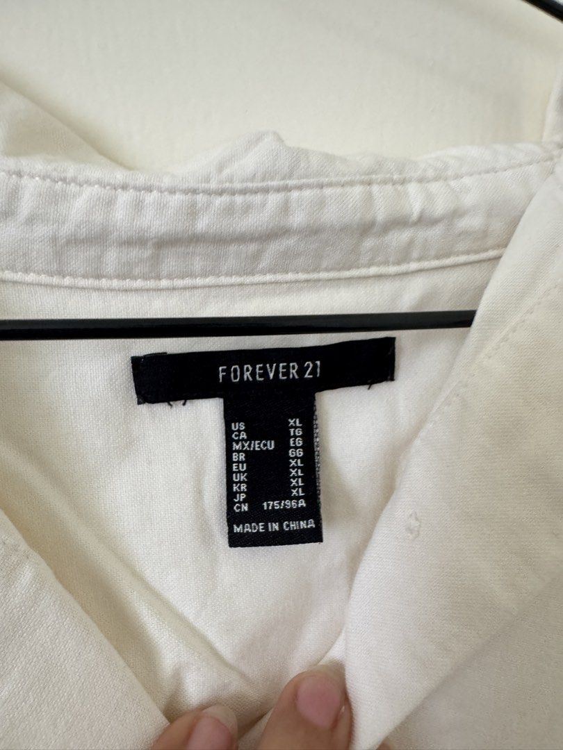 Forever 21 White Oversized Button-Up Shirt XL (Category: Shirts) located in Mandaluyong City. Submitted by trinket.ph (Listing ID 1440964670, Image 2). Description: - Off White oversized button-up shirt - Brand: Forever 21 - Size: XL (Relaxed fit) - Ideal for layering or wearing on its own - Easy to style for casual or smart-casual looks - Please check photos for exact shade and details.