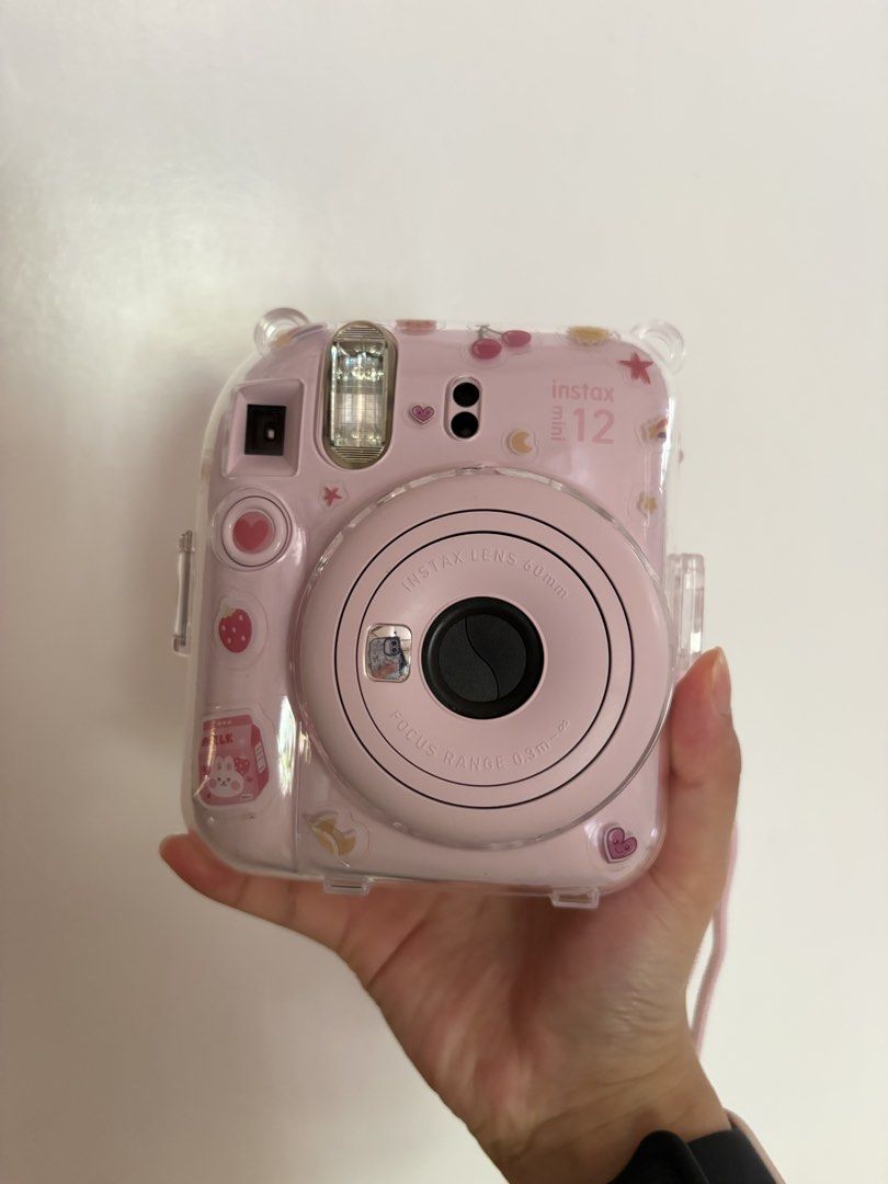 Fujifilm Instax Mini 12 Camera with Pink Case (Category: Cameras) located in Bangued. Submitted by chonky_mj (Listing ID 1440989277, Image 1). Description: - Pink Fujifilm Instax Mini 12 camera -Includes Alkaline Battery - Includes clear protective case with cute stickers - Comes with a matching pink carrying case - Ideal for capturing memories on the go - Also comes with the original box - Ready for its new owner! Mode of Payment: Gcash/Maribank