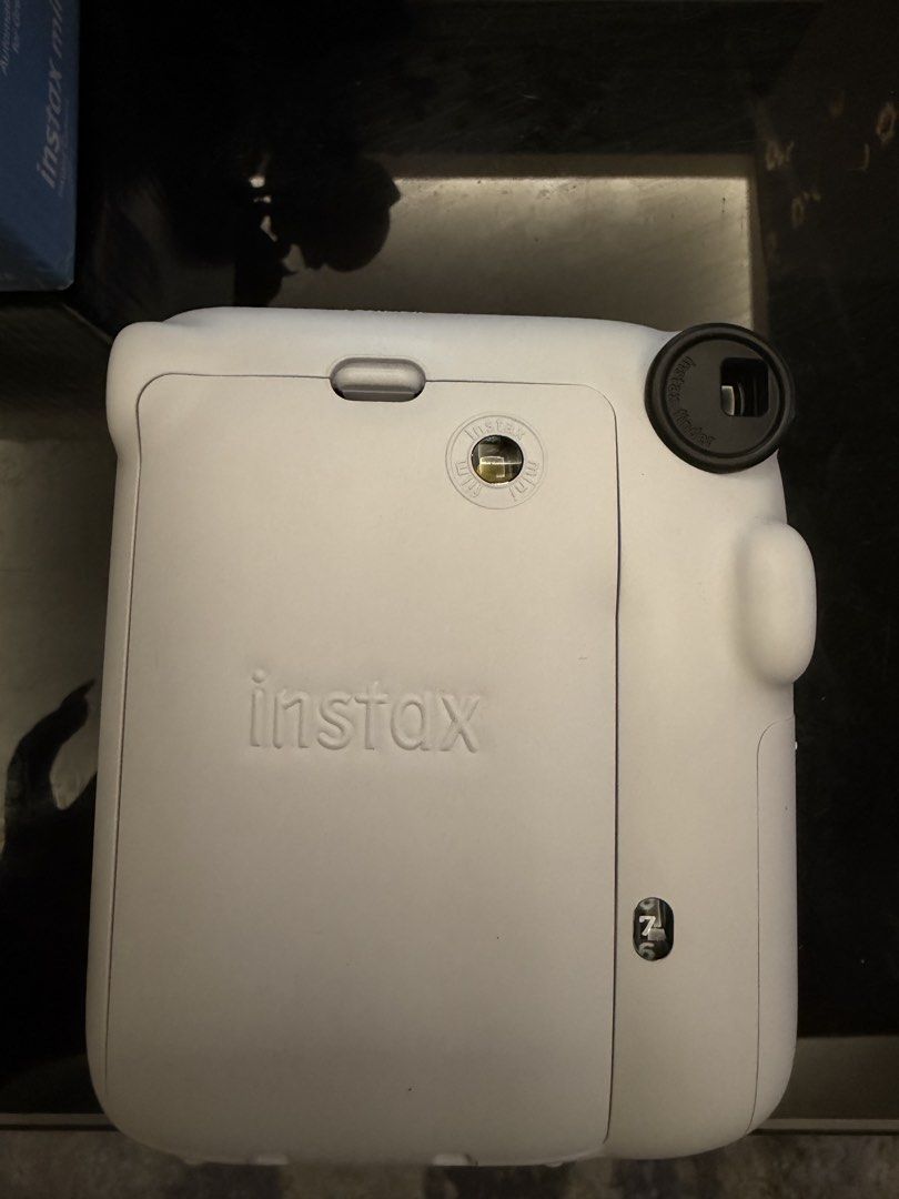 Fujifilm Instax Mini 12 Instant Camera - Clay White (Category: Cameras) located in Taguig. Submitted by crsthngs (Listing ID 1441098531, Image 3). Description: - Fujifilm Instax Mini 12 Camera - Color: Clay White - Includes original box - Comes with a black camera case - With 7 Films inside.