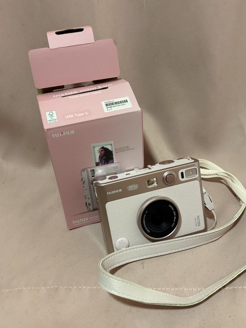 Fujifilm Instax Mini Evo Hybrid Instant Camera (Category: Cameras) located in Quezon City. Submitted by polinandaya (Listing ID 1441038310, Image 3). Description: - Fujifilm Instax Mini Evo Hybrid Instant Camera - Includes original box and strap - USB Type-C charging for convenience - Capture and print memories instantly.