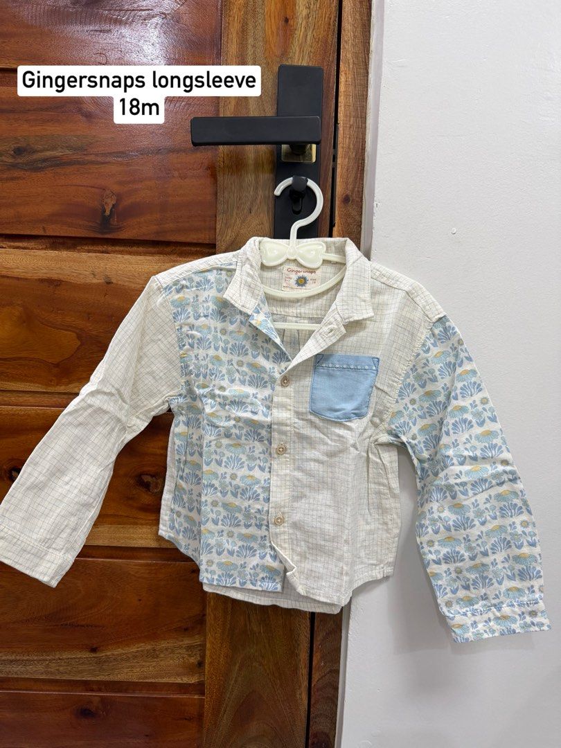 Gingersnaps Long Sleeve Shirt 18m (Category: Babies & Kids Fashion) located in Pasig City. Submitted by abbbbbbbi (Listing ID 1441083517, Image 1). Description: - Brand: Gingersnaps - Size: 18 months - Style: Long sleeve shirt - Design: Mix of checkered and patterned fabric - Accent: Light blue pocket - Features: Easy button-up closure, soft fabric for comfort - Occasion: Great for everyday wear or special occasions.