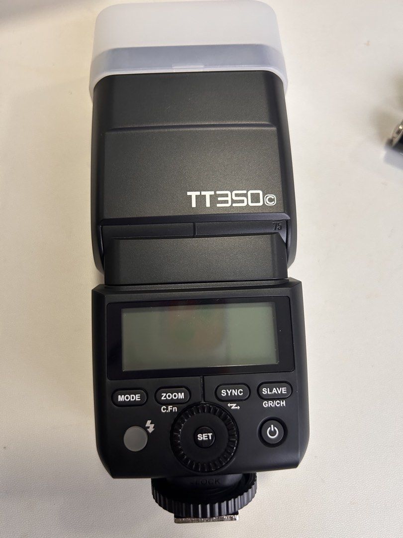 Godox TT350C Camera Flash (Category: Flashes) located in Singapore. Submitted by gregorynks (Listing ID 1441043321, Image 1). Description: - Godox TT350C Camera Flash - Excellent working condition - Features: Mode, Zoom, Sync, Slave functions - Clear LCD screen - Comes with a diffuser - Perfect for your next photography session.
