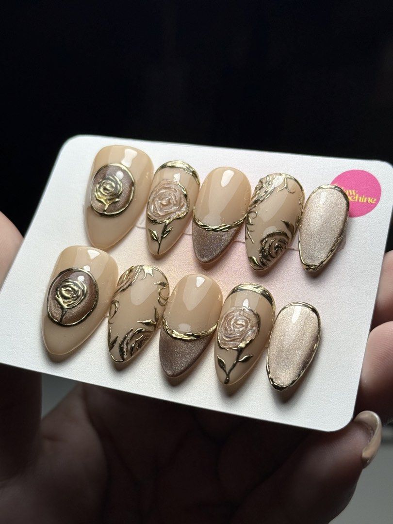 Golden Rosé Set (Press-ons/Customized) (Category: Hands & Nails) located in Pasay City. Submitted by clawmachine2025 (Listing ID 1440957990, Image 1). Description: 💅 AFFORDABLE CUSTOMIZED PRESS-ON NAILS 💅 Available Nail Shapes: • Oval • Almond • Stiletto • Square • Squoval • Ballerina ✨ What’s Included: • 10-piece customized press-on nail set • Prep kit (alcohol pad, nail buffer, and orange stick) • 20 pcs. adhesive sticky tabs • 1 pc. nail glu