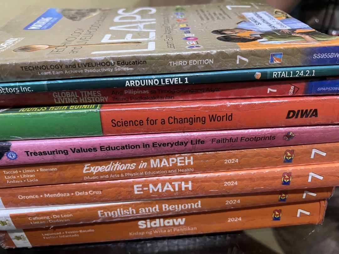 Grade 7 K-12 Textbooks - Various Subjects (Category: Textbooks) located in Quezon City. Submitted by sjlsrolling (Listing ID 1441013822, Image 2). Description: - Grade 7 Textbook Bundle (2024 Edition) - Subjects: E-Math, Science, English and Beyond, Values Education, Expeditions in MAPEH, Sidlaw, Global Times Living History, LEAPS - Publishers include Phoenix, Matador, and DIWA - All books are the latest 2024 editions - Ideal for students needing
