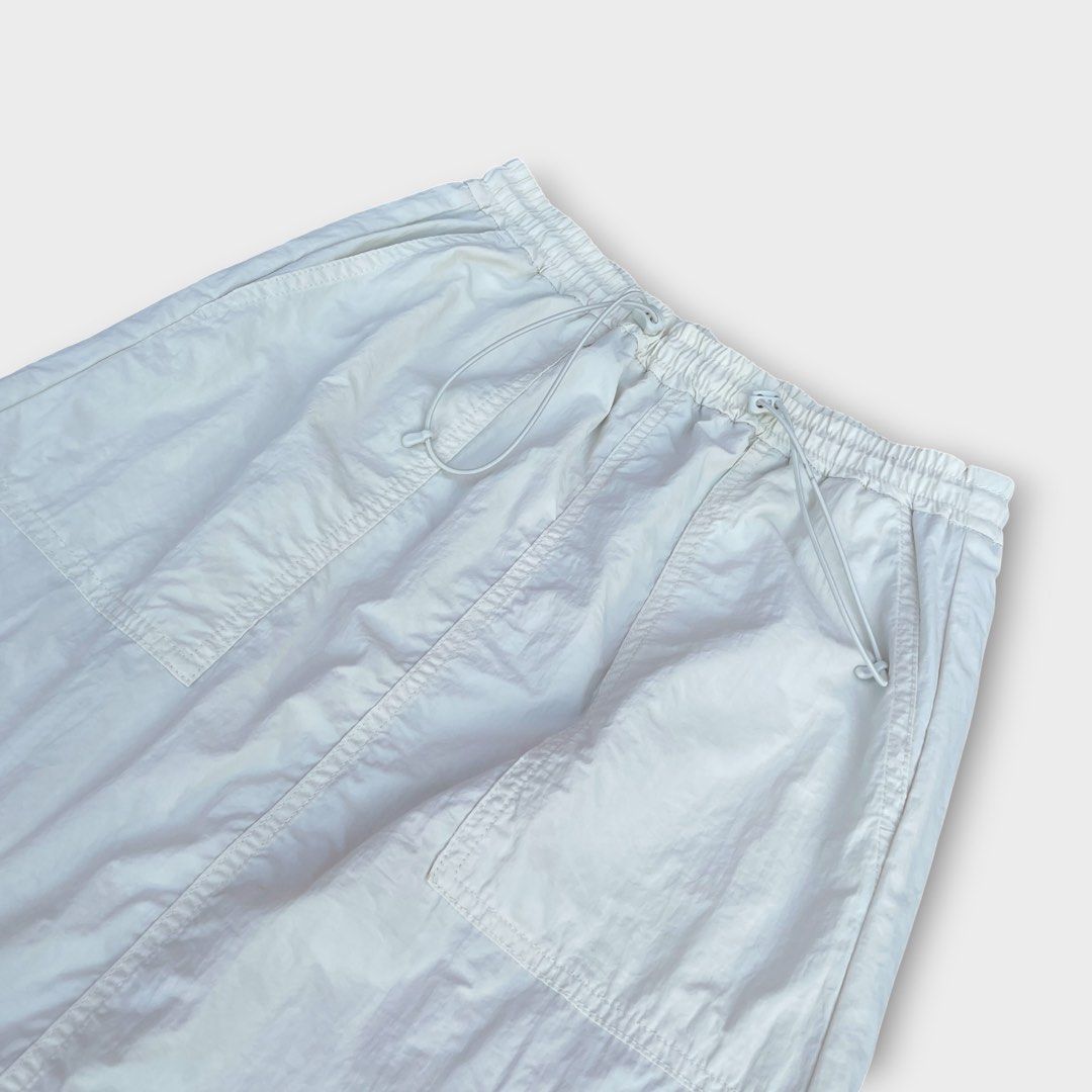 GU Uniqlo - Tech Nylon Long Skirt (Category: Skirts) located in Los Banos. Submitted by declutterking (Listing ID 1441125923, Image 3). Description: Size Medium on tag • 2 side pockets • back center slit Dimensions: 12.75" waist 33" length 21.75" hem Good as new condition Authentic.