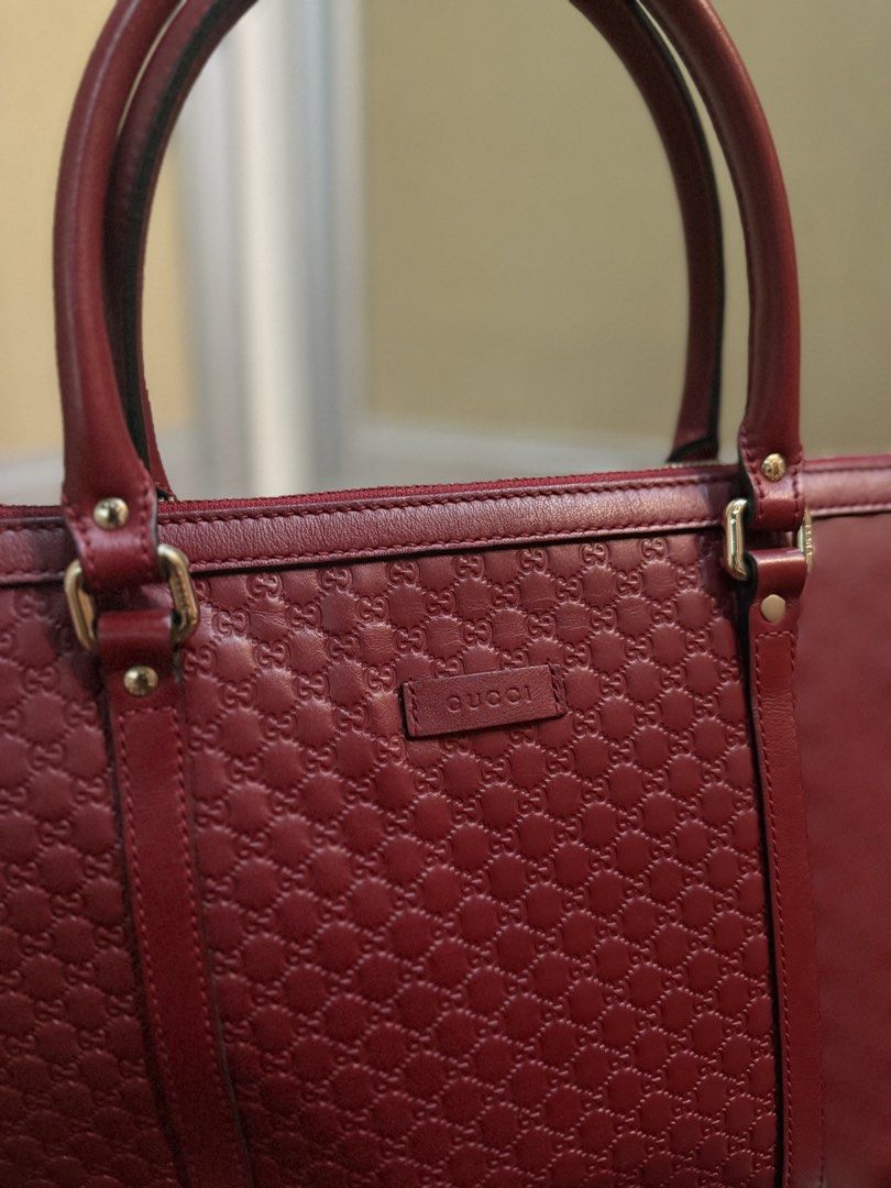 Gucci Microguccissima Leather Tote Bag (Category: Luxury Bags & Wallets) located in Quezon City. Submitted by calea (Listing ID 1441121222, Image 2). Description: Authentic Gucci Microguccissima tote bag in red color - comes with dustbag - in excellent used condition, clean interior!, minor scuffs at the corners but barely noticeable - with detachable shoulder strap - has secure zipper closure so perfect for travels! - multiple interior pockets f