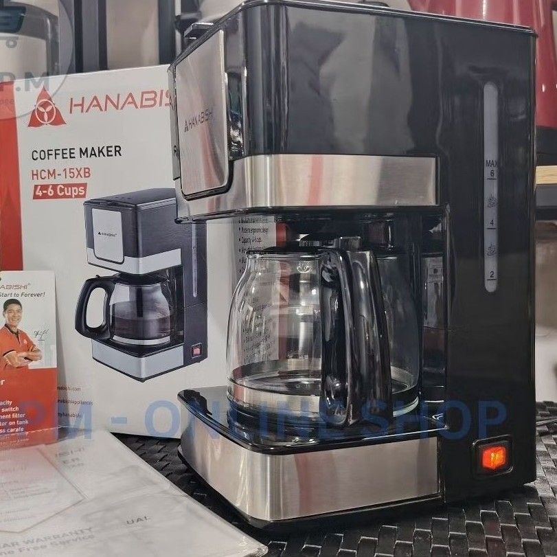 Hanabishi Coffee Maker HCM 15XB (Category: Coffee Machines & Makers) located in Manila. Submitted by biaman (Listing ID 1441131144, Image 2). Description: - Hanabishi Coffee Maker (Model: HCM 15XB) - Brews up to 6 cups of coffee - Convenient water level indicator - Reusable cone-style permanent filter - Illuminated ON/OFF switch for easy operation - Comes with a durable glass carafe and brew basket - Simple and easy to use for your daily coffee n