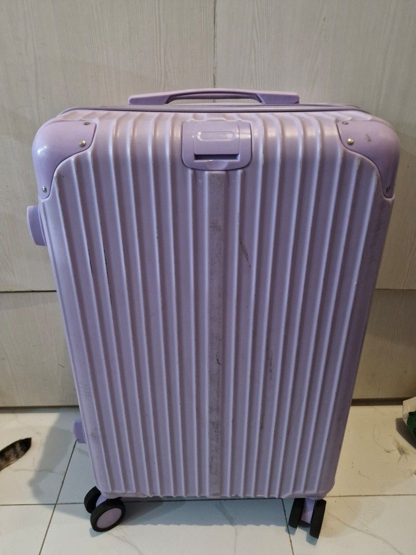 Hardshell Luggage (Category: Luggage) located in Quezon City. Submitted by kimavillanueva (Listing ID 1441112624, Image 1). Description: - brand: Island Elephant - Durable purple hardshell exterior - Smooth-rolling wheels for easy transport - Integrated combination lock for security - interior with zippered compartments is broken - Minor scuffs and marks on exterior (normal wear) - Ideal for all your travel needs -No other issues except internal 
