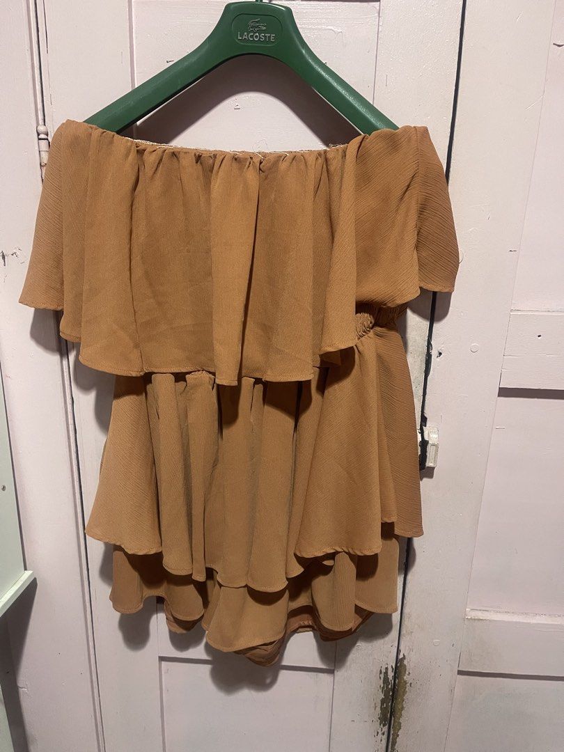 Haute Fox Brown Tiered Ruffle Off-Shoulder Romper 3X (Category: Rompers) located in Manila. Submitted by gecah (Listing ID 1441127397, Image 1). Description: - Brand: Haute Fox - Color: Brown - Design: Tiered ruffle, off-the-shoulder neckline - Features: Smocked bodice for comfort, elastic waistband - Size: 3X - Occasion: Great for a night out or a casual day.