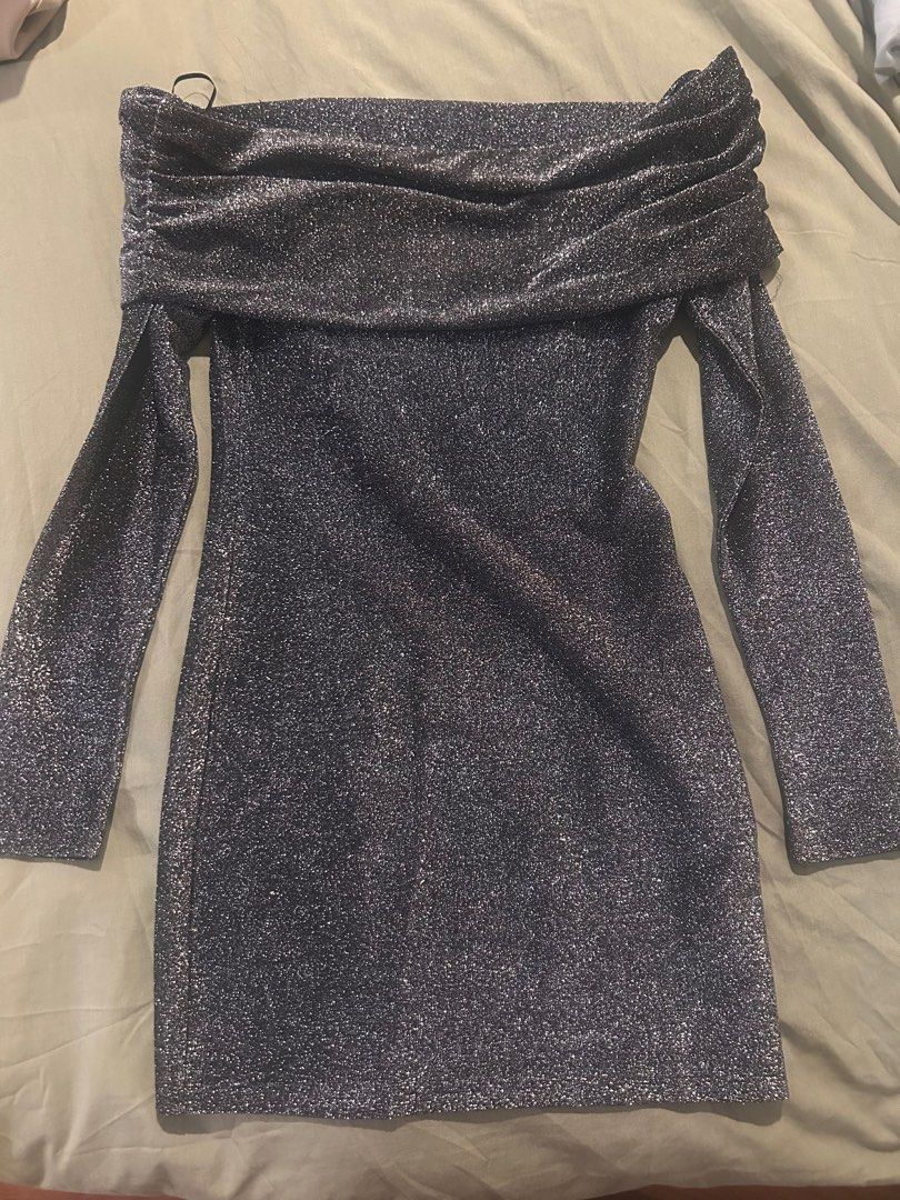 H&M Divided Glittery Off-Shoulder Dress (Category: Dresses) located in Quezon City. Submitted by be_declutterandthrift (Listing ID 1441084601, Image 3). Description: The body-con silhouette effortlessly hugs your curves, while the elegant, wide over-the-shoulder fold creates a dramatic, romantic neckline that highlights the collarbones. Perfect for parties, holiday celebrations, or a glamorous night out, its long, sleek sleeves balance the mini l