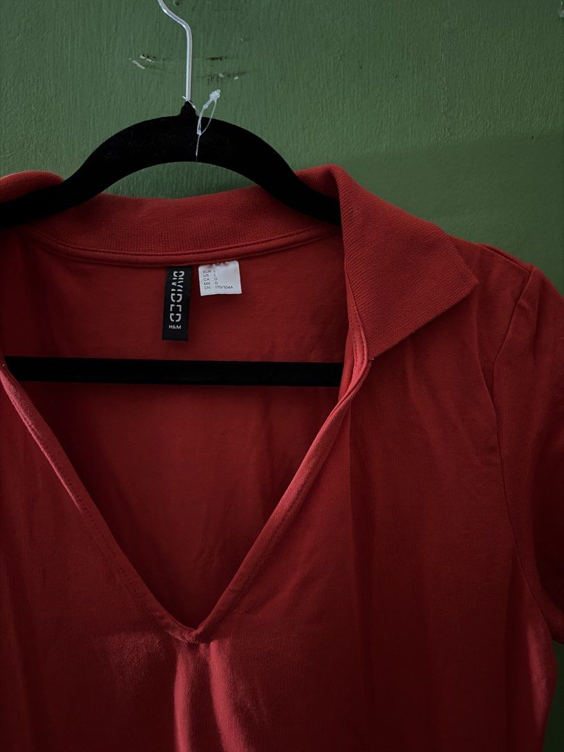 H&M Divided Red Collared V-Neck Short Sleeve Dress (Category: Dresses) located in Angeles City. Submitted by cathrionaj28282 (Listing ID 1441002914, Image 2). Description: - Red short sleeve dress from H&M Divided - Features a collared neckline with a V-neck opening - Made from soft jersey-like fabric - Ideal for casual wear or layering - Versatile for dressing up or down - Fitted.