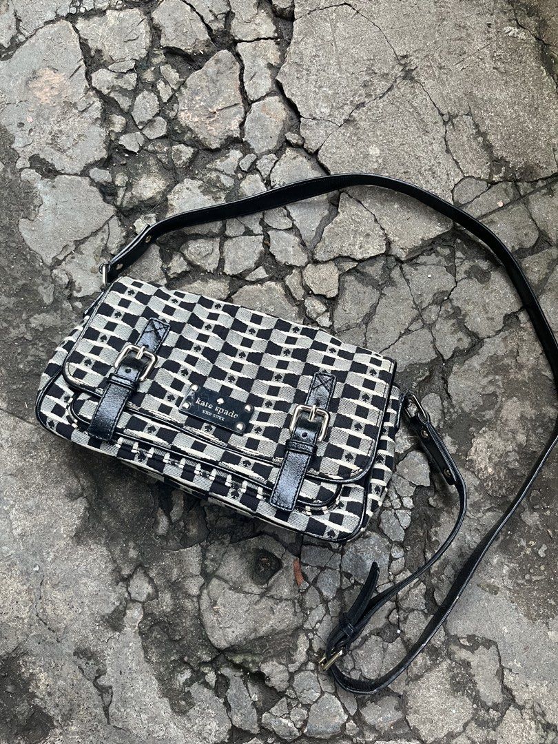Kate Spade Black & White Checkerboard Shoulder Bag (Category: Shoulder Bags) located in Muntinlupa City. Submitted by cutiepie143 (Listing ID 1441067698, Image 1). Description: - Cute Kate Spade shoulder bag - Classic black and white checkerboard pattern - Stylish patent leather trim and strap - Spade details throughout - Front flap with decorative buckle - Interior includes a zip pocket and slip pockets - Ideal for everyday use and adding a touc