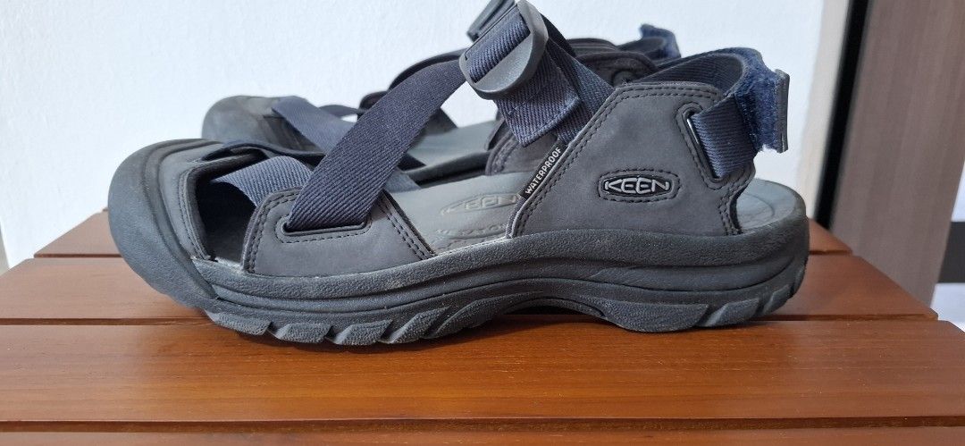 KEEN Sandals (Category: Casual shoes) located in Singapore. Submitted by shong886 (Listing ID 1441002144, Image 1). Description: - KEEN sandals - Colour: Dark grey and navy blue straps - size US 9.5 - Features adjustable straps for a secure fit - Durable sole for long-lasting wear - Ideal for outdoor activities and water adventures - Ready for your next trip!.