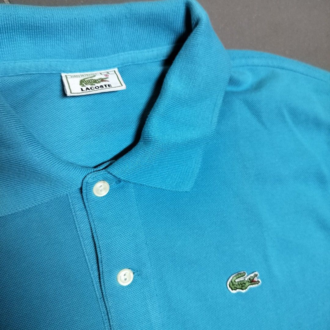 Lacoste Polo Shirt Blue Size 4 (Category: Tshirts & Polo Shirts ) located in Manila. Submitted by markjunks00 (Listing ID 1440962149, Image 2). Description: - Classic blue Lacoste polo shirt - Iconic crocodile logo - Made in France - 100% cotton material - Comfortable and breathable - Great for casual wear.
