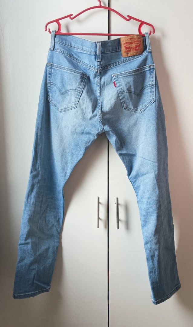 Levi's 502 Light Wash Denim Jeans (Category: Jeans) located in Manila. Submitted by shop_no.15 (Listing ID 1441033077, Image 2). Description: - Classic Levi's 502 jeans - Light blue wash - Straight leg fit -Size 29 on tag, can fit up to Size 32 - Zip fly closure - Iconic blank red tab and leather patch - Altered lenght already, 37 inches - Versatile staple for any wardrobe.