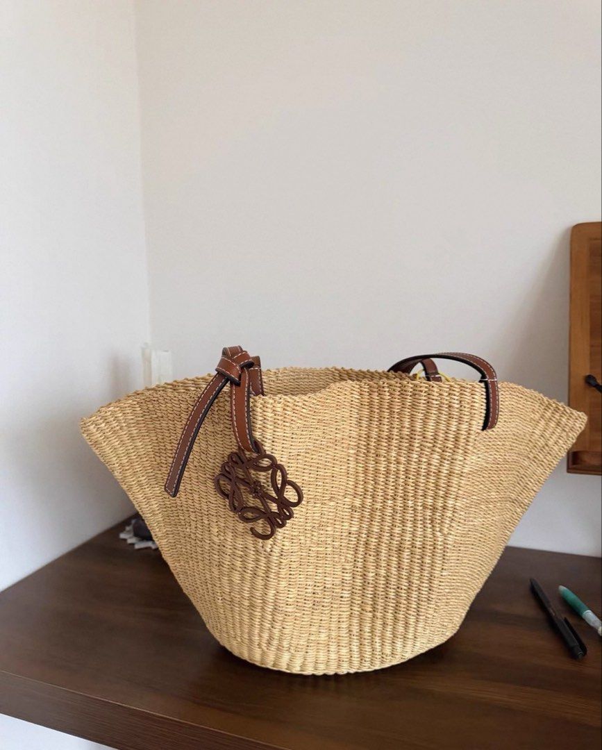 Loewe Shell Basket Raffia Bag (Preorder) (Category: Luxury Bags & Wallets) located in Manila. Submitted by designerarchives.ph (Listing ID 1441147079, Image 2). Description: Rare design | Discontinued in most countries 🌴 • 10 days eta • 50% dp is required. • No refund, return, or exchange. • Buyer will shoulder the sf. Shipping: NCR - lalamove/grab Provincial - LBC.