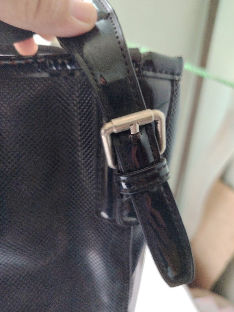 Longchamp Black Textured Leather Bucket Bag (Category: Cross-body Bags) located in Taguig. Submitted by roxie0419 (Listing ID 1440957122, Image 3). Description: - Black Longchamp Bucket Bag - Textured Leather Exterior - Adjustable Strap with Buckle Detail - Interior with Stylish Patterned Lining - Ideal Size for Daily Essentials - Meticulously Clean Inside and Out - Honest issue may mark ng punit pro kaya irepair. See last pic for reference. Over