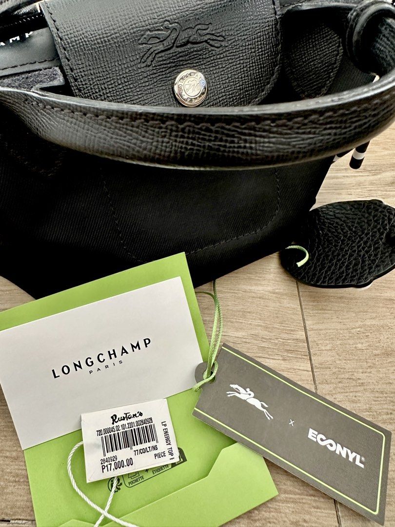 Longchamp energy Xsmall (Category: Luxury Bags & Wallets) located in Las Pinas. Submitted by kluxuryshop (Listing ID 1441013543, Image 3). Description: 100% Authentic. Bought from Rustans. Comes with original tags only. With extra sling adjustable and removable. Made in China. SRP: 17,000 pesos. Like new. No stains, tear or any damage. bag charm Not included. Last Price Posted. FREE SHIPPING VIA LBC. Boxed. No rush shipping please..