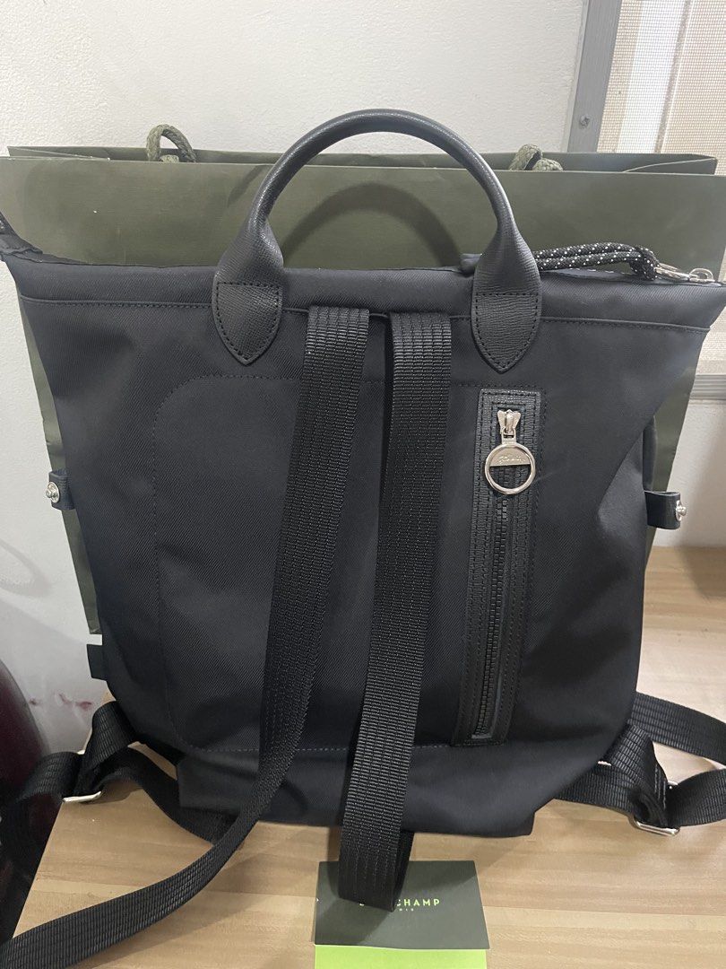 Original Longchamp Le Pliage Energy L Backpack (Category: Luxury Bags & Wallets) located in Manila. Submitted by sellerfes (Listing ID 1441020989, Image 2). Description: Brand new. Never been used in commute. If you know your bag, you know this is for you. No receipt. Comes with the original card and package. Reason for selling: need funds - Authentic Black Longchamp backpack - Made from durable nylon with elegant leather details - Convenient zip
