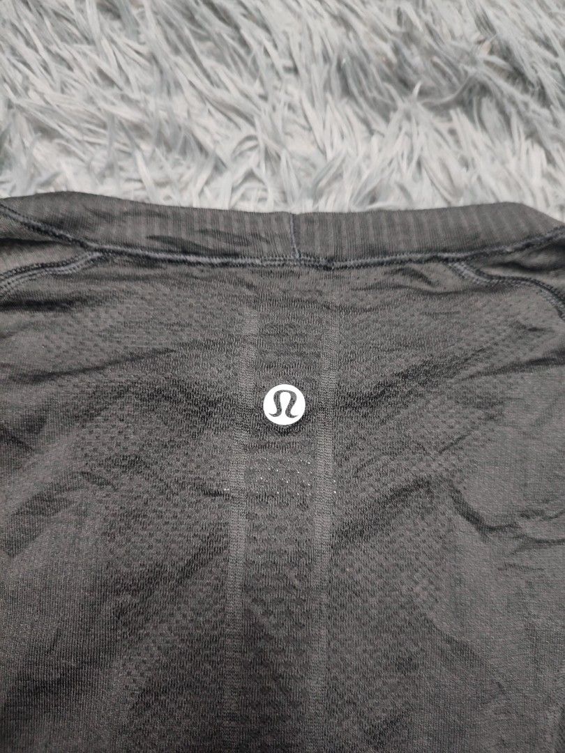 Lululemon Long Sleeve Top (Category: Activewear) located in Baguio. Submitted by barepicksph (Listing ID 1441043175, Image 3). Description: -Features thumbholes for extra comfort and coverage - Textured fabric with a subtle Lululemon logo on the back - Versatile for workouts or everyday casual wear - Approximate measurements: 28 inches (length) x 16 inches (width).