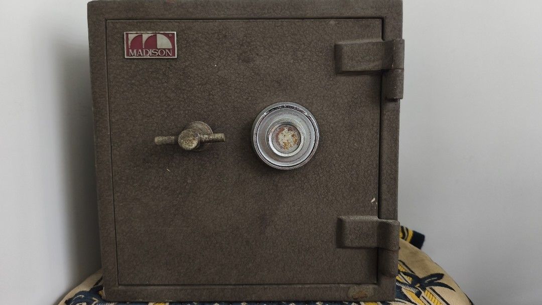 Madison Safe with Combination Lock (Category: Safe) located in Makati City. Submitted by qualityfamilystuff (Listing ID 1441155856, Image 1). Description: - Vintage Madison safe - Features a combination dial lock and handle - Textured exterior finish - Shows minor signs of wear, consistent with age - Ideal for securing your valuables.